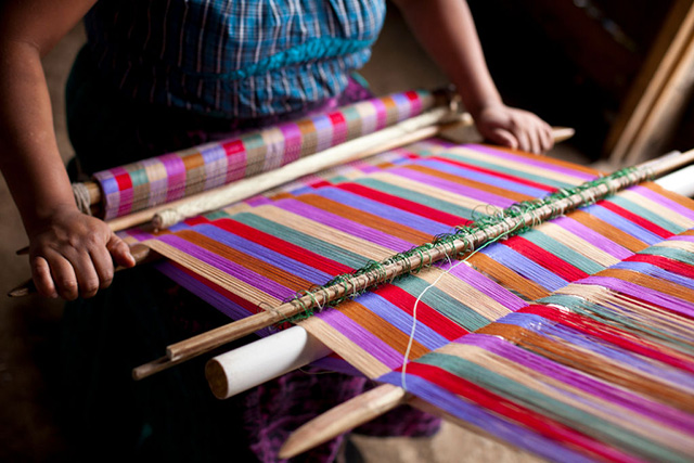 A Guatemalan woman weaves making textiles in the traditional way, in San Juan La Laguna - one of the villages on the banks of Lake Atitlan. (Photo: Phil Clarke Hill / In Pictures via Getty Images)