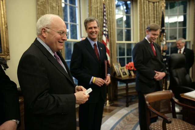 Vice President Dick Cheney (L) gathers with other senior members of the US Government during remarks by President George W. Bush about the North Korean missile launches in the Oval Office of the White House in Washington July 5, 2006. (Photo: Brooks Kraft LLC / Corbis via Getty Images)