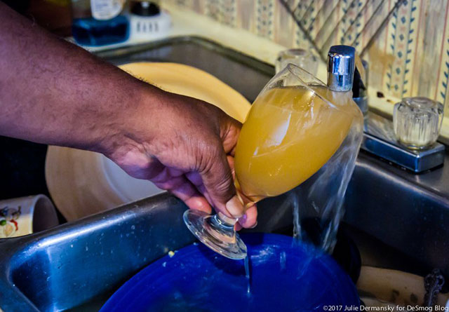 St. Joseph, Louisiana, resident Lee Richardson gets discolored water from his tap, which tested positive for lead.