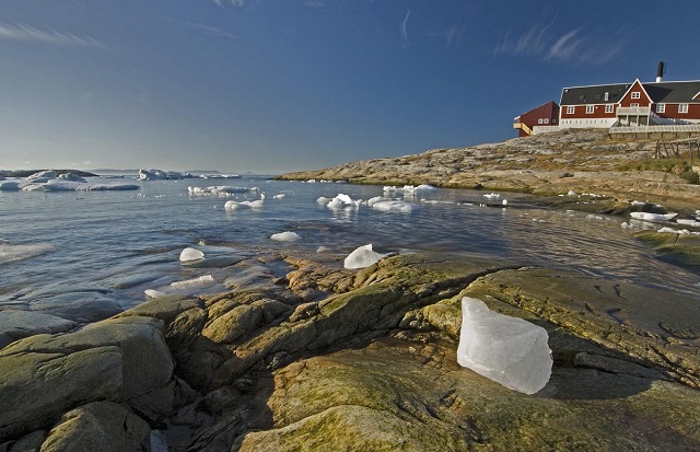 Iceberg remnants from the Greenland Ice Sheet and the Ilulissat Hospital, west coast of Greenland. (Photo: Bruce Melton)