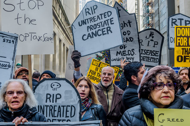 About 500 protesters chanting Kill the Bill, Don't Kill Us! filled the street outside the New York Stock Exchange on December 19, 2017 — where the resources siphoned from the poor and middle class by the Republican tax bill will be concentrated. (Photo: Erik McGregor / Pacific Press / LightRocket via Getty Images)