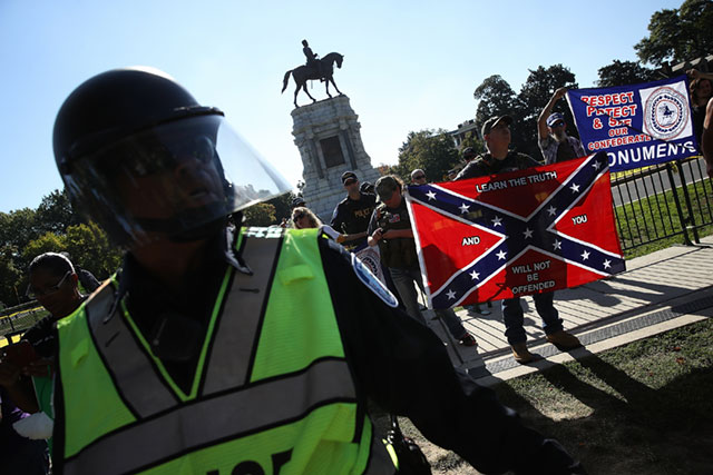 Richmond police keep members of the Tennessee based group 'New Confederate State of America' separated from counter protesters, September 16, 2017, in Richmond, Virginia. The group held a protest in support of retaining the statue of Confederate Gen. Robert E. Lee that is located on Richmond's Monument Avenue. (Photo: Win McNamee / Getty Images)
