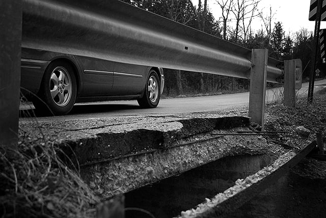 A car drives over a crumbling Missouri bridge on February 22, 2011. (Photo: KOMUnews)
