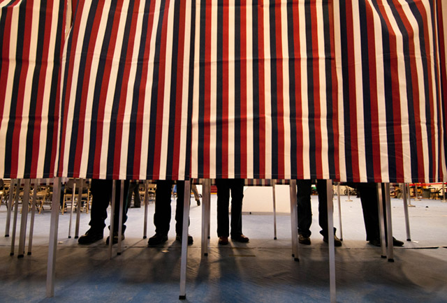 Voting booths. (Photo: Andrew Cline / Shutterstock.com)