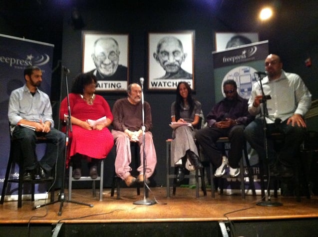 Enemy of the state panel from left to right: Fahd Ahmed, Adwoa Masozi, Alfredo Lopez, Seema Sadanandan, Dhoruba Bin-Wahad, Jared Ball. The panel took place at Busboys and Poets in Washington, DC, on October 24, 2013. (Photo: Rania Khalek)