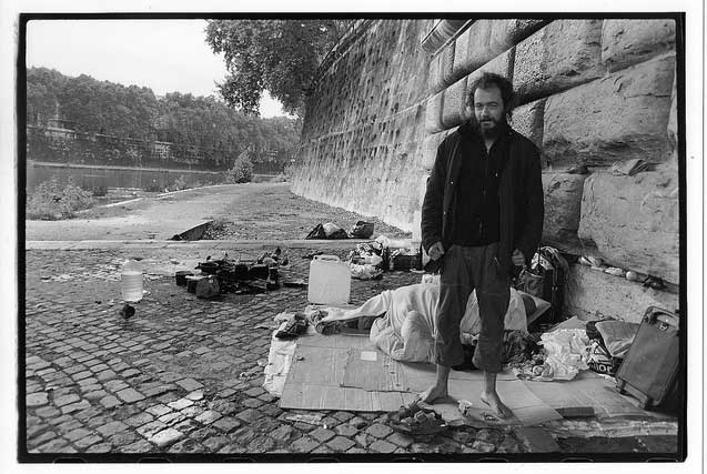 Homeless man in a camp by the Tiber River. (Photo: David Bacon)