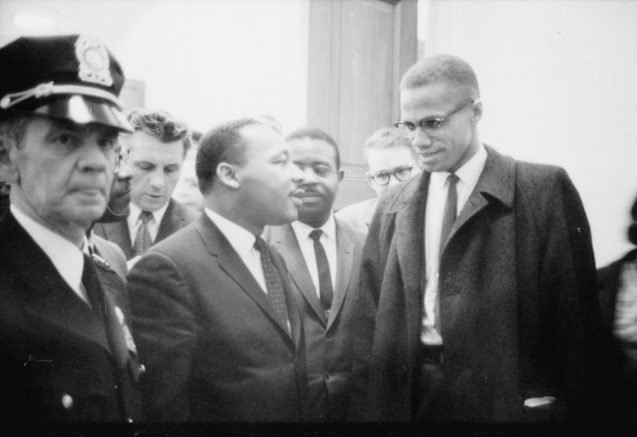 Martin Luther King and Malcolm X waiting for press conference, March 26, 1964. (Photo: <a href=