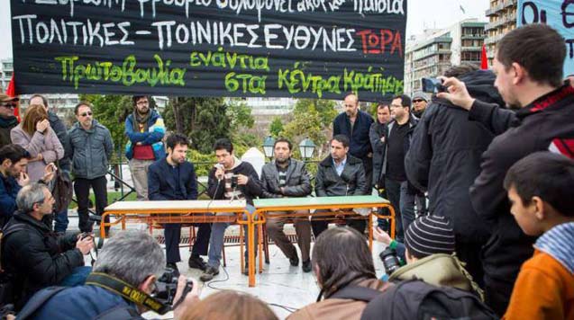 Three survivors of the Farmakonisi incident give a press conference with the help of a translator about the incident on Syntagma Square in Athens. (Photo: Angelos Kalodoukas)