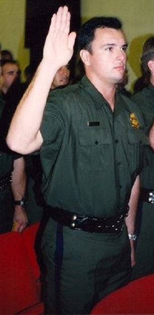Robert MacLean takes the Federal Law Enforcement Training Center graduation oath, October 22, 2011. (Photo <a href=