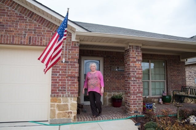Debbie Ingram in front of her home in 'Meadows at Hickory Creek' subdivision. (Photo: ©2014 Julie Dermansky)