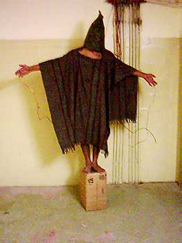 An Iraqi prisoner photographed during torture in the Abu Ghraib prison. 
