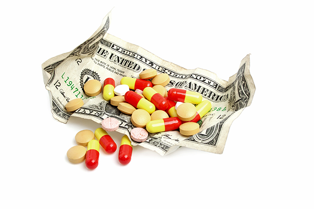 (Image: Pills and dollars via Shutterstock)