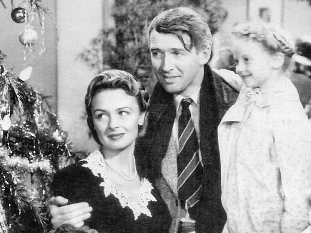 Screenshot of Jimmy Stewart and Donna Reed in <em>It’s a Wonderful Life</em> (1946).” width=”640″ height=”480″ /><span style=