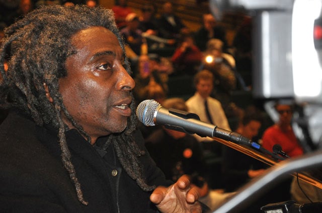 Community activist Willie Phillips reminds the City Council at its Dec. 16 meeting that an approved policy to document the race of all people stopped by police was to be implemented in October, but has yet to be put in place. (Photo: Judith Scherr)
