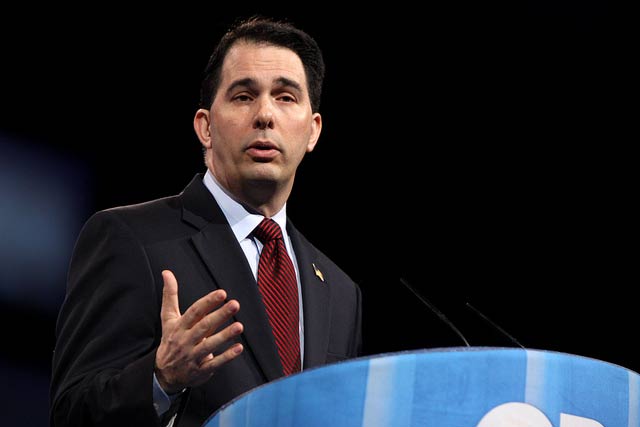 Governor Scott Walker of Wisconsin speaking at the 2013 CPAC in National Harbor, Maryland. In addition to slashing $300 million from the University of Wisconsin budget, Walker slipped language into his proposed budget bill taking an ax to the Wisconsin Idea, the guiding philosophy of the UW System.