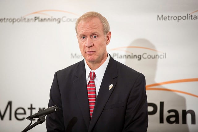 Rauner is methodically manufacturing an economic crisis for his state, one that will let him do what he has long been set on doing: shrink the government and squeeze the 99 percent. (Photo: Metropolitan Planning Council)