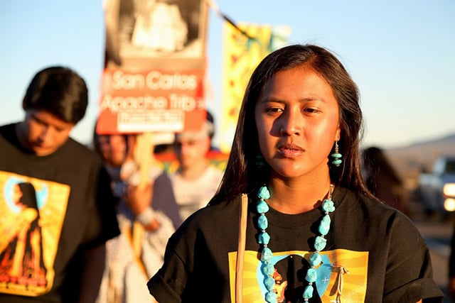 Naelyn Pike stands at the reservation line leaving the San Carlos Apache Reservation. (Photo: Roger Hill)