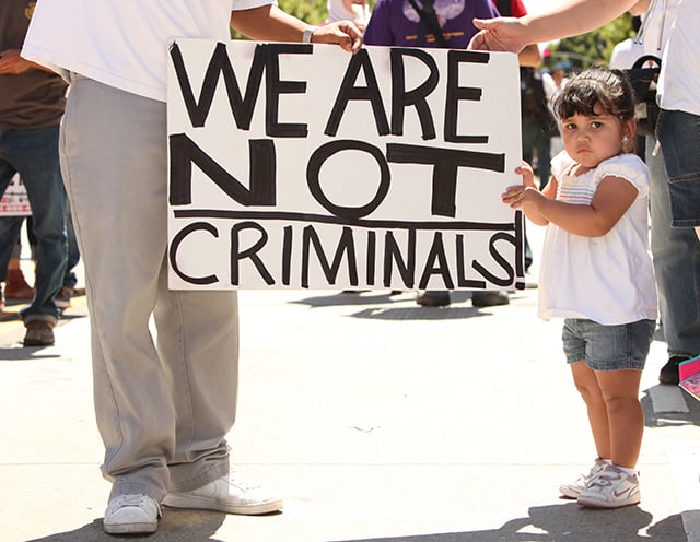 1 May, 2010: Maria, 8, demonstrates at the May Day Immigration Protest Rally in opposition to regressive Arizona immigration laws. (Photo via Shutterstock)