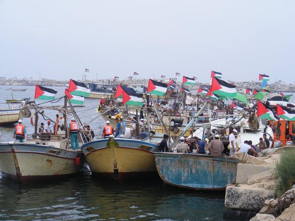 4 September, 2008: Boats flying the Palestinian flag welcome the Free Palestine vessel in Gaza. (Photo: Free Gaza movement)