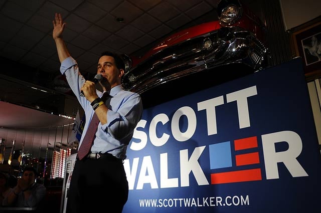 Wisconsin Governor Scott Walker speaking in Amherst, New Hampshire, July 16. Cindy Archer, Walker's former top aide, made allegations that state prosecutors investigating corruption around Walker engaged in aggressive raids on people's homes - allegations contradicted by newly-released audio.