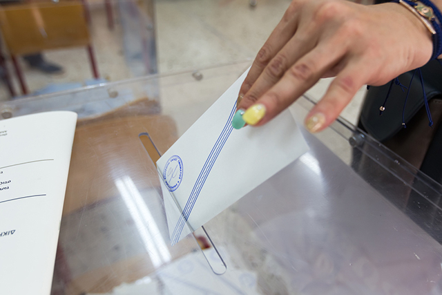 25 May, 2014: Greek woman places ballot in voting box during the 2014 Greek elections in Thessaloniki, Greece. Turnout for the 2015 elections plummeted by comparison, with a 45% abstention rate. (Photo via Shutterstock)