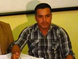 Teacher and municipal councilor-elect Rigoberto Lima Choc denounces the mass fish die-off on the La Pasión River at a press conference on June 17. He was fatally shot September 18.