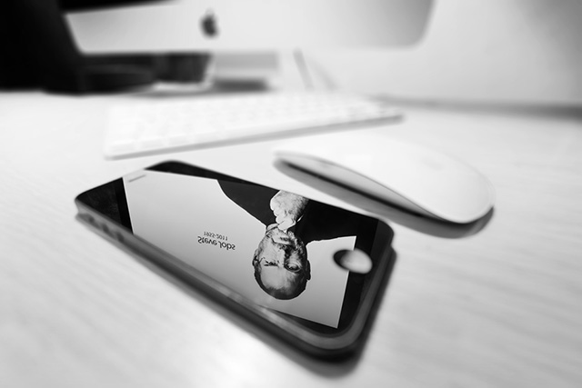 (Photo: Apple products and Steve Jobs' reflection via Shutterstock)