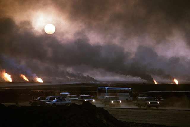 Oil well fires rage outside Kuwait City in the aftermath of the First Gulf War on  March 21, 1991. Retreating Iraqi troops set fire to Kuwait's oil fields. (Photo via Shutterstock)