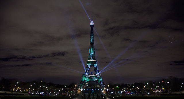The Eiffel Tower, covered by a green visual forest as part of the UN climate change conference in Paris, France, December 2.