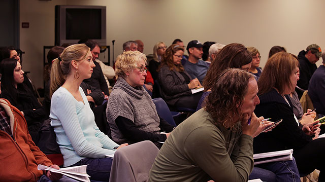 Residents of Penn Township listen to testimony at a zoning board hearing on Jan. 14 for one of Apex’s proposed well pads. If the zoning board approves the permit, it will be only the second permit granted in Penn Township for fracking. (Photo by Natasha Khan / PublicSource)