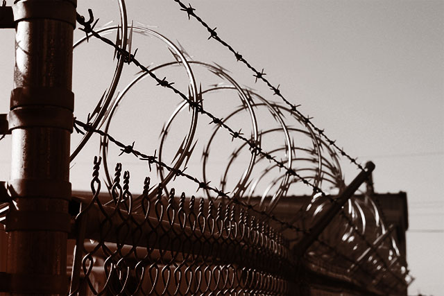 (Photo: Prison Fence via Shutterstock; Edited: LW / TO)