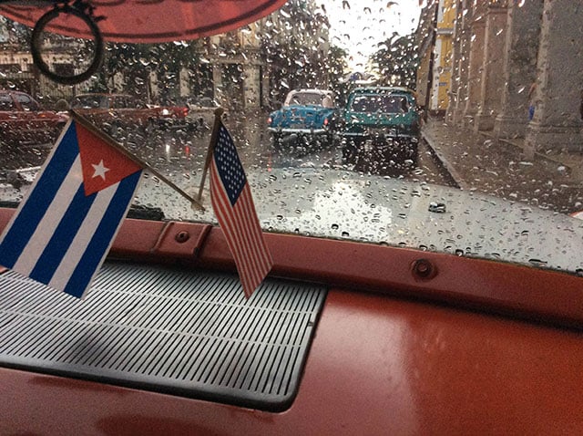 A taxi cab in Havana displays the Cuban and American flags together during Obama's visit. (Photo: Patrick Sheehan)
