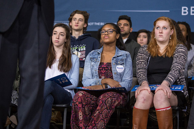 Students on stage listen to Bernie Sanders speak to their classmates at Roosevelt High School inDesMoines, Iowa on January 28, 2016. (Photo: Phil Roeder) 