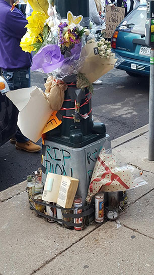 Flowers and candles at Dion Damon's Memorial. (Credit: Christina Ryder)