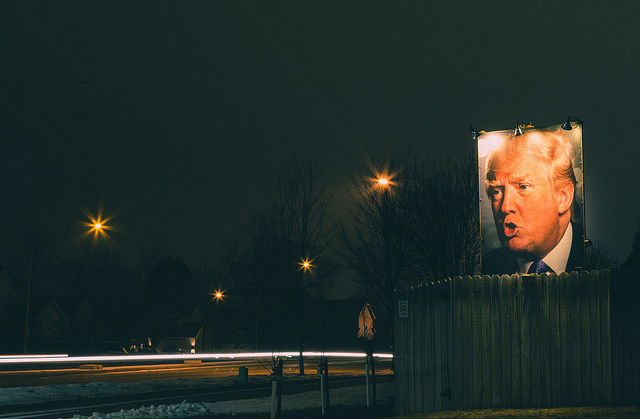 A Donald Trump poster looms over a residential fence in West Des Moines, Iowa, in a photo taken on January 23, 2016. (Photo: Tony Webster)
