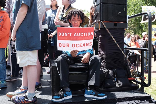 A young demonstrator holds a sign during a protest against offshore drilling in Washington DC. The Obama administration is finalizing a five-year plan to auction off large portions of the Gulf of Mexico and Arctic seas to private oil and gas companies. (Photo: Sabelo Narasimhan)