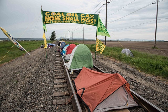 Tents along BNSF Tracks Leading to Refineries in Anacortes, Washington. (Photo: Courtesy of Elliot Stoller)