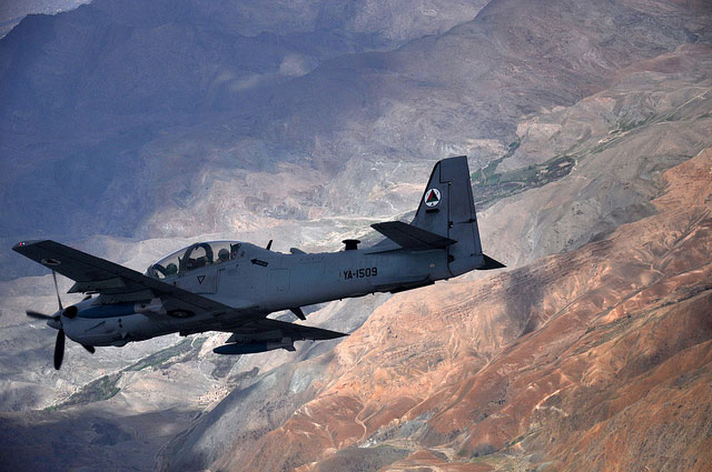 An A-29 Super Tucano flies over Afghanistan during a training mission April 6, 2016. In spite of the 100,000 close-air-support sorties flown between 2011 and 2015 — more than one sortie per Taliban fighter — failing to bring about peace, US military forces continue struggling to bomb their way to victory.