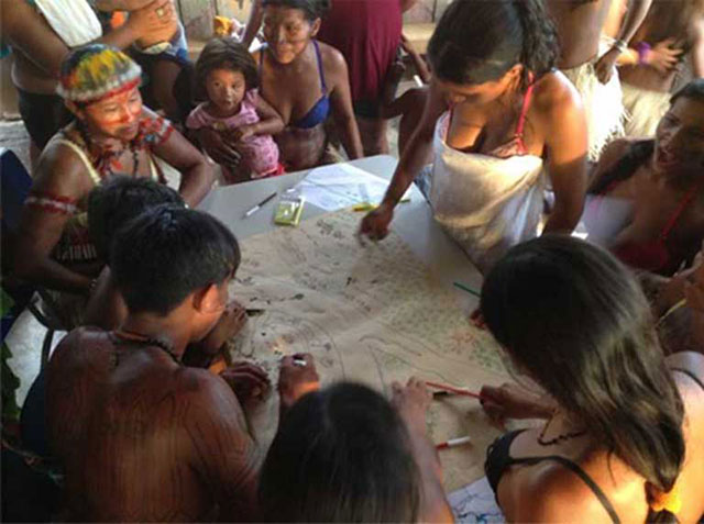 Indigenous Munduruku living on the Teles Pires River taking part in a mapping workshop delineating their territory. Indigenous people and river communities have seen, and will continue to see, territory lost, fisheries disrupted and depleted, and food security diminished, with the construction of the Tapajós Basin dams, roads and railway. (Photo: International Rivers on Flickr, licensed under an Attribution-NonCommercial-ShareAlike 2.0 Generic [CC BY-NC-SA 2.0] license)