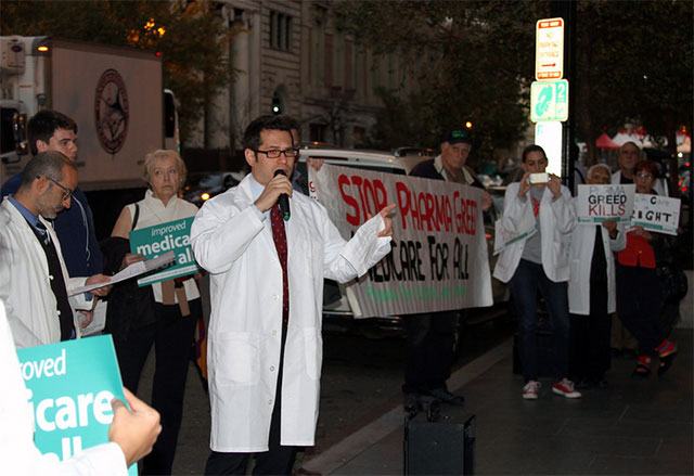 Protesters demonstrate outside the Washington headquarters of the Pharmaceutical Research and Manufacturers of America (PhRMA) in November 2016 to protest the skyrocketing prices of prescription drugs and the blatant profiteering of the drug industry. (Credit: Physicians for a National Health Program)