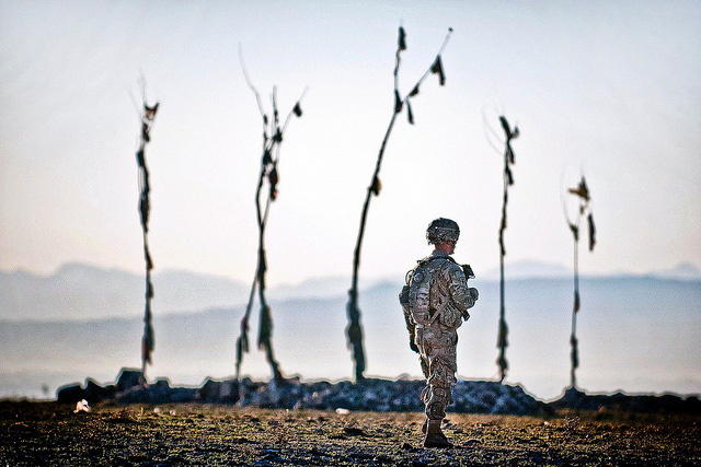 a paratrooper walks past an Afghan graveyard during a US – Afghan patrol April 30, 2012, Ghazni province, Afghanistan. (Photo: Sgt. Michael J. MacLeod / The US Army)