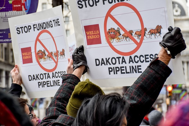 Demonstrators gather to protest Wells Fargo's funding of the Dakota Access pipeline on February 3, 2017. Many of the banks, including Wells Fargo, that fund the pipeline are also funding those that will funnel fossil fuels from the Canadian tar sands.