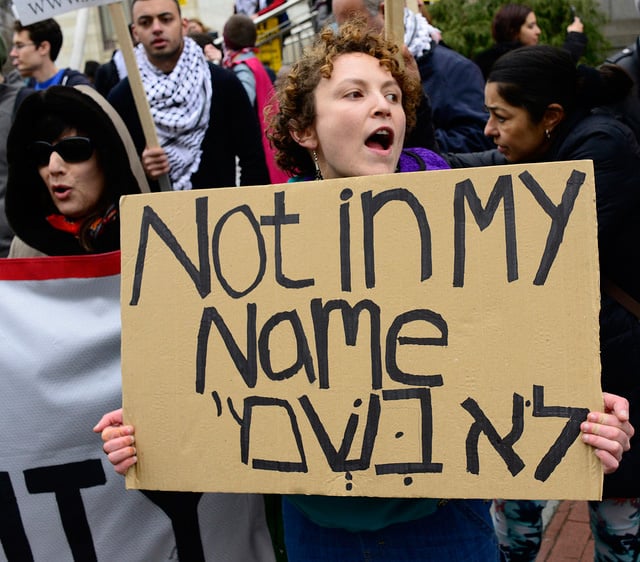 An activist displays a sign during a rally for Palestinian rights on March 26, 2017, in Washington, DC. (Photo: Stephen Melkisethian)