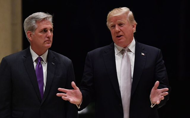 Donald Trump (right) speaks beside House Majority Leader Kevin McCarthy at Trump International Golf Club in West Palm Beach on January 14, 2018. (Photo: NICHOLAS KAMM / AFP / Getty Images)