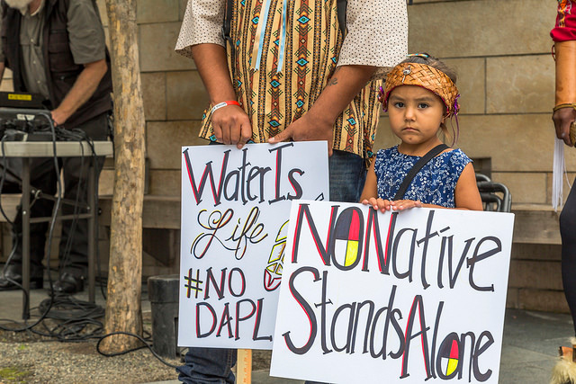 A young activist holds a sign during a march in solidarity with Standing Rock Water Protectors in Seattle, Washington, on September 16, 2016. (Photo: John Duffy)