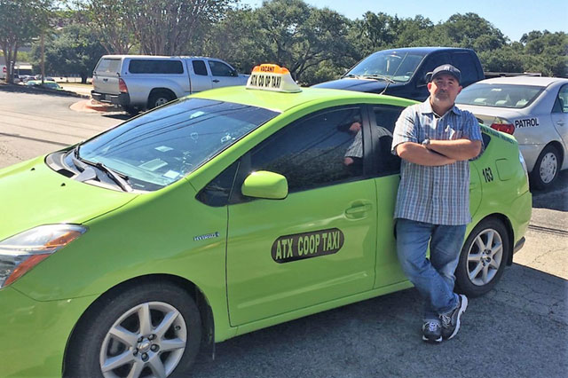 ATX Coop Taxi driver Ebrahim Elhadidi standing in front of his car in Austin, Texas. (Photo: WNV / Dave Passmore)