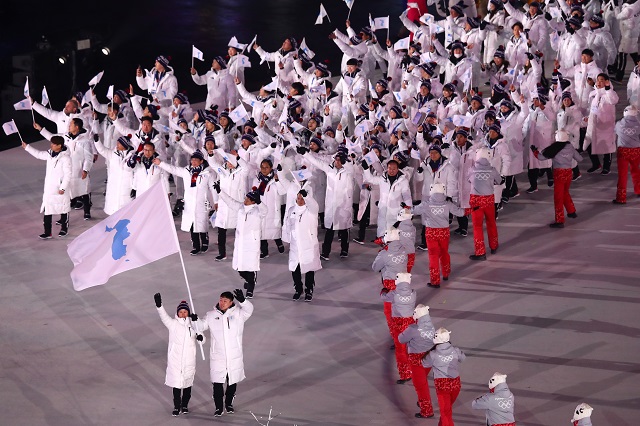 The North Korea and South Korea Olympic teams enter together under the Korean Unification Flag during the Parade of Athletesduring the Opening Ceremony of the PyeongChang 2018 Winter Olympic Games at PyeongChang Olympic Stadium on February 9, 2018 in Pyeongchang-gun, South Korea. (Photo by Dean Mouhtaropoulos/Getty Images)
