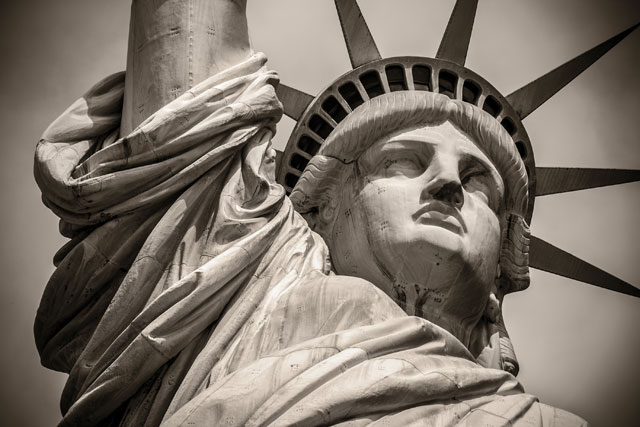 Trump's immigration policies have run counter to the ideals of the poem on the Statue of Liberty's pedestal. (Photo: Marcio Jose Bastos Silva / Shutterstock)