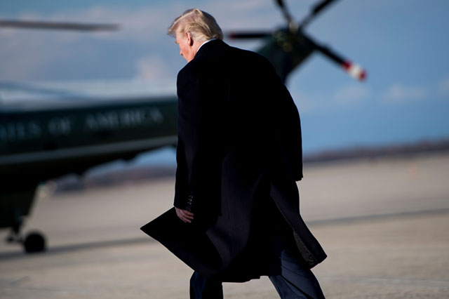 President Donald Trump walks to Marine One from Air Force One at Andrews Air Force Base, Maryland on March 25, 2018. (Photo: Brendan Smialowski / AFP / Getty Images)