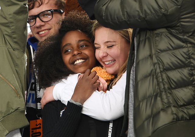 Naomi Wadler, 11, of Alexandria, Virginia, is hugged by Marjory Stoneman Douglas High School student, Jaclyn Corin, near the conclusion of March for Our Lives on Saturday, March 24, 2018, in Washington, DC. (Photo: Matt McClain / The Washington Post via Getty Images)